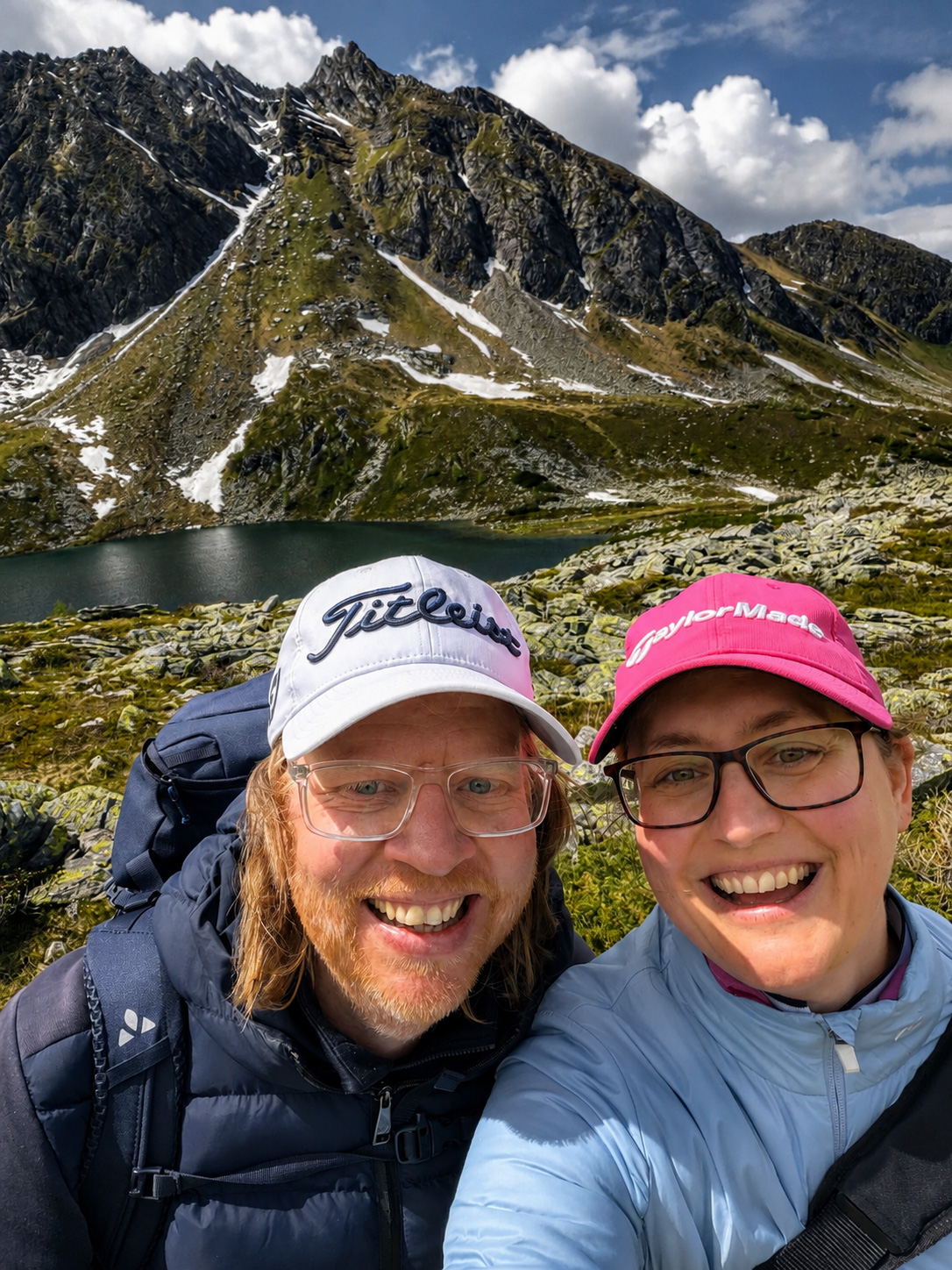 Fine art landscape photographer hiking with his wife to a remote alpine lake in Bad Hofgastein, Austria, during a photography expedition in summer 2026.